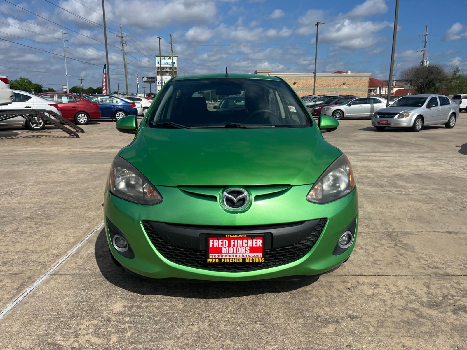 2013 green /black Mazda MAZDA2 Touring (JM1DE1LY1D0) with an 1.5L L4 DOHC 16V engine, Automatic transmission, located at 14700 Tomball Parkway 249, Houston, TX, 77086, (281) 444-2200, 29.928619, -95.504074 - Photo #1
